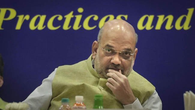 Shah questions Congress record on tribal welfare