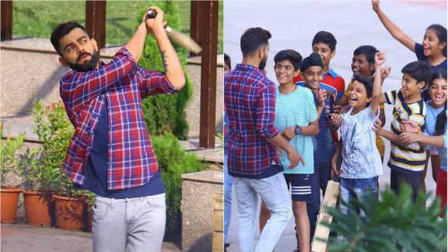 Virat Kohli plays `gully cricket' with kids